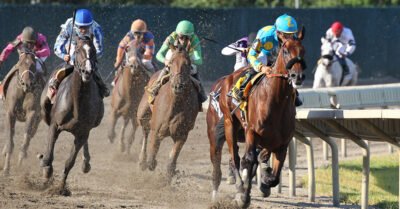 American Pharoah #4 with Victor Espinoza riding, leads the field around the final turn enroute to victory in the $1,750,000 Grade 1 William Hill Haskell Invitational at Monmouth Park in Oceanport, New Jersey on Sunday August 2, 2015.  Photo By Ryan Denver/EQUI-PHOTO.